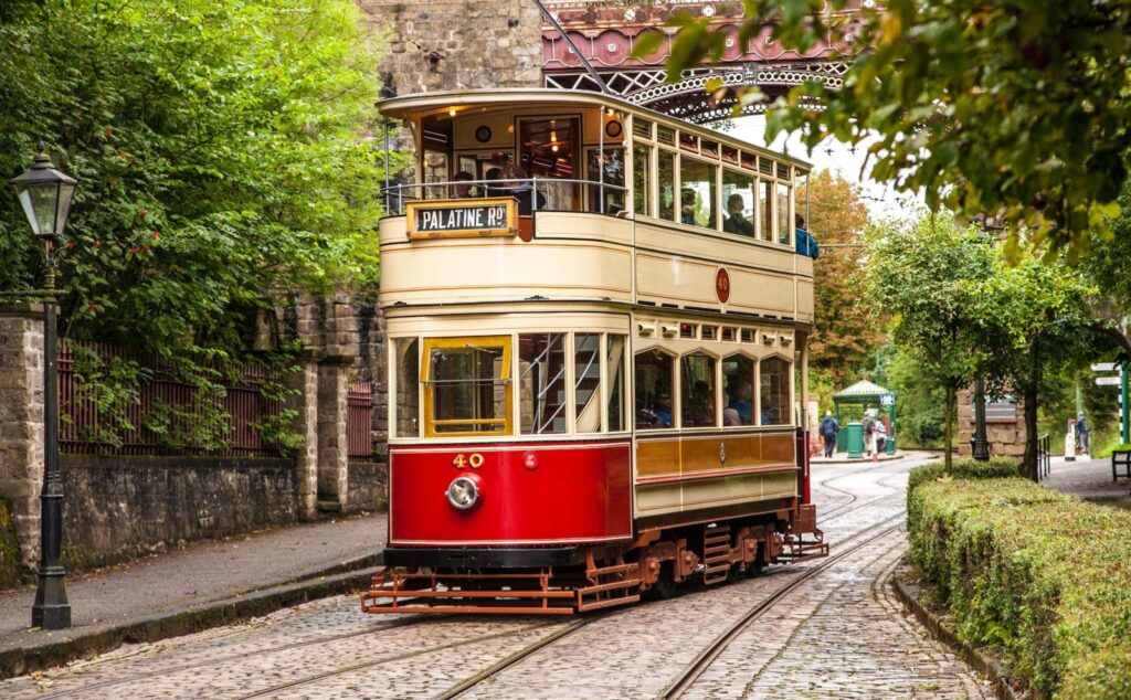 Early 20th tram passing under Bowes Lyon bridge at Crich Tramway village