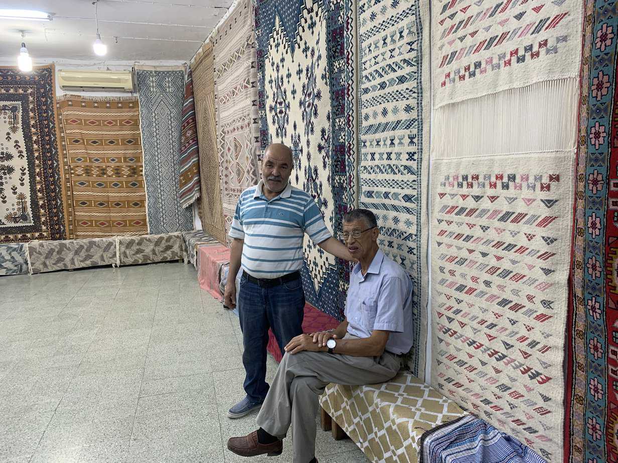 With Hassan and the proprietor of the rug shop